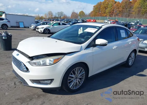 2016 Ford Focus Titanium z USA, uszkodzony, nr VIN 1FADP3J24GL236096
